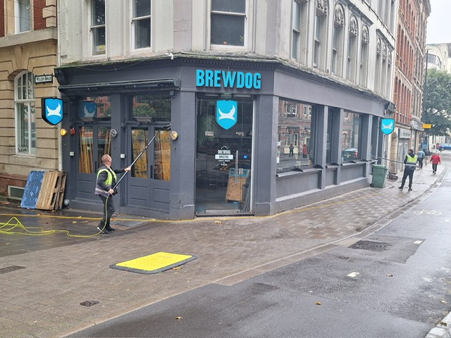 AquaClean operatives cleaning the windows at a BrewDog bar